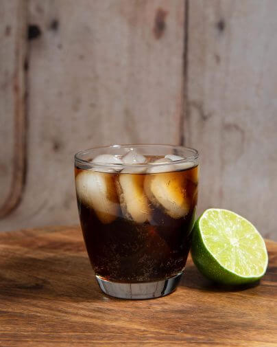 Windsor Cola Cocktail with a lime on the side