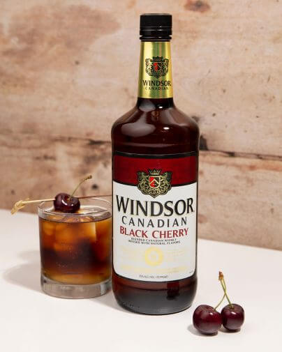 Windsor Canadian Black Cherry Cocktail with a black cherry bottle