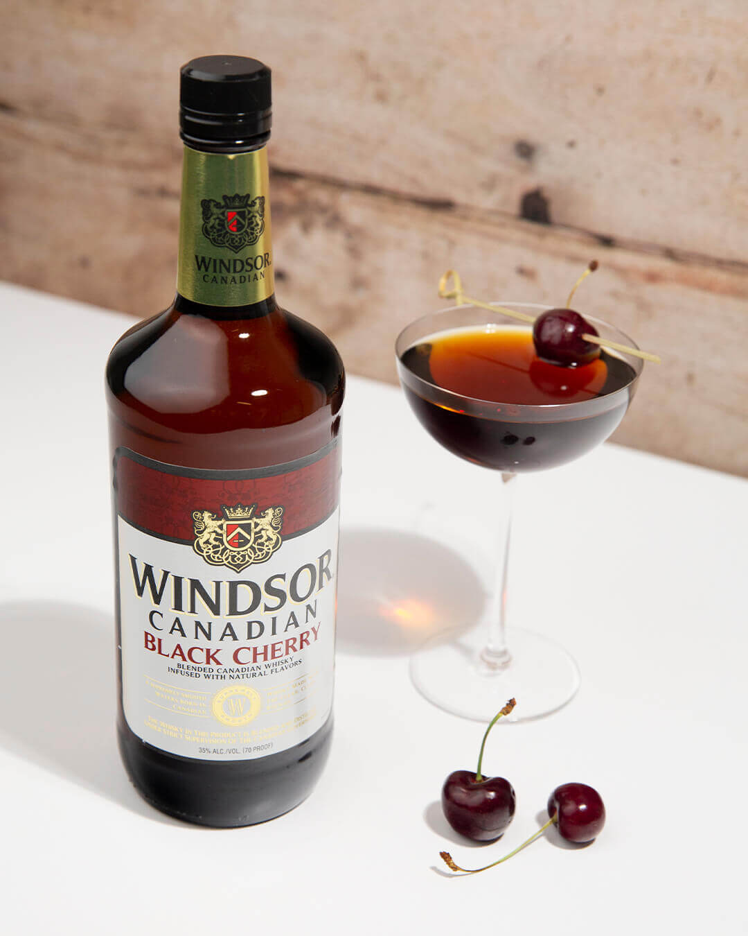 Windsor Canadian Black Cherry Manhattan Cocktail with a Black Cherry Bottle