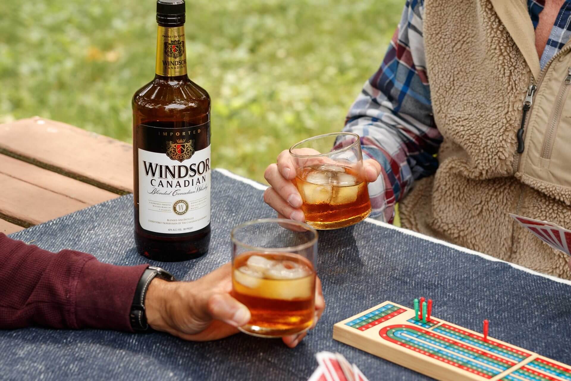2 people cheering with Windsor Whiskey